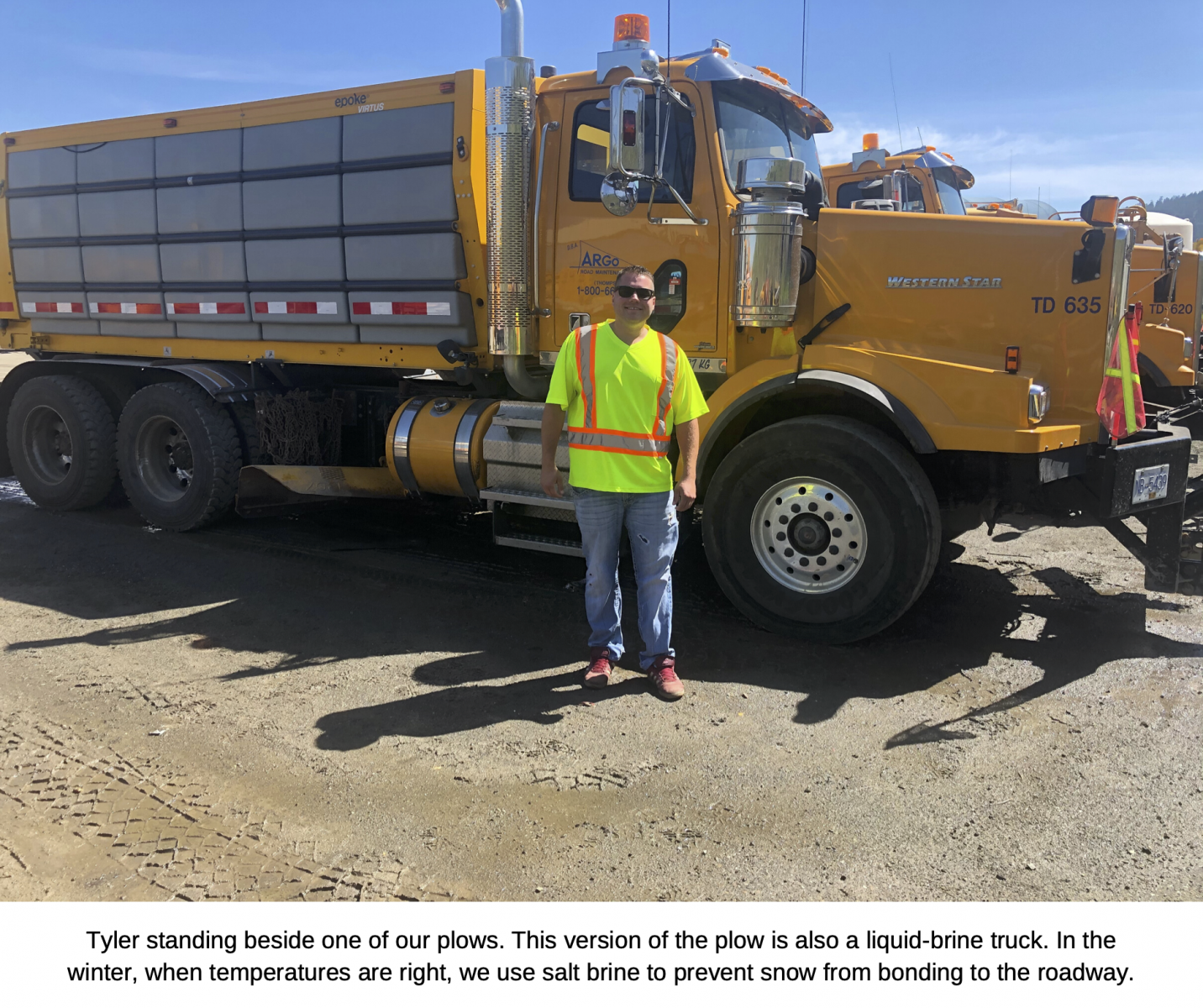Tyler standing beside one of our plows. This version of the plow is also a liquid brine truck. In the winter, when temperatures are right, we use salt brine to prevent snow from bonding to the roadway.